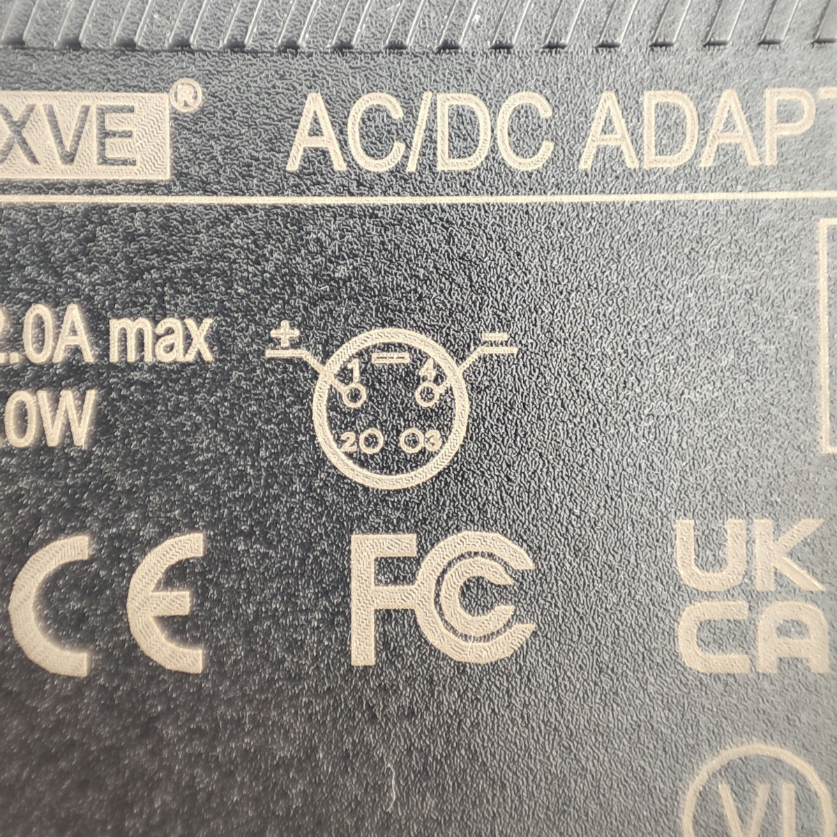 Escooterparts 42V 2A lithium battery charger label showing 4-pin XLR connector diagram and safety certifications.