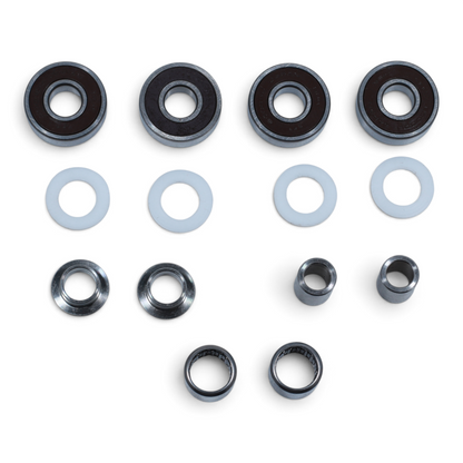 Escooterparts Surron Light Bee X frame and swingarm maintenance kit with metal bearings, spacers, and white washers.
