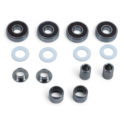 Escooterparts Surron Light Bee X frame and swingarm maintenance kit with bearings, spacers, and metal bushings.